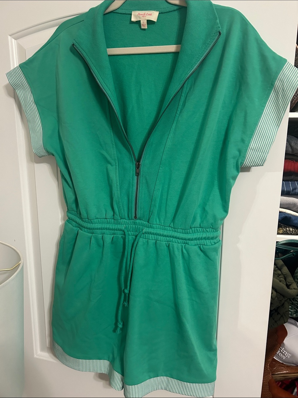Green short sleeve romper with zipper and tied waist